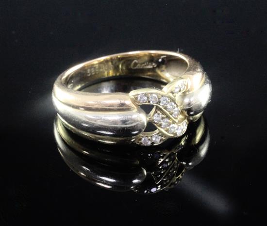 A 1980s Cartier three colour 18ct gold and diamond set ring, size L.